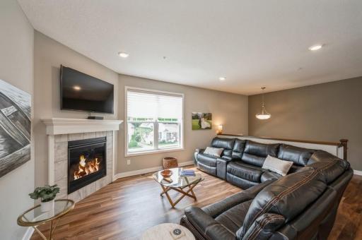 Curl up in the glow of the fireplace on those chilly evenings. This welcoming family room may become your favorite place to spend time in your home.