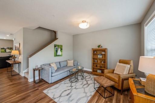 This living room can also become a dining area if you want more space for the family room on this level. The neutral decor throughout the home is ready for your personal decorating style.