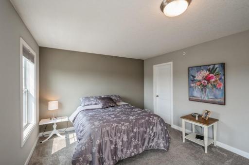 The primary bedroom suite can accommodate large furniture pieces and offers a variety of options for placement. One walk-in closet is on this side of the room.