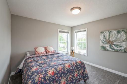 Bedroom, office, hobby room, exercise area...you decide! Neutral window blinds make decorating your new home much easier.