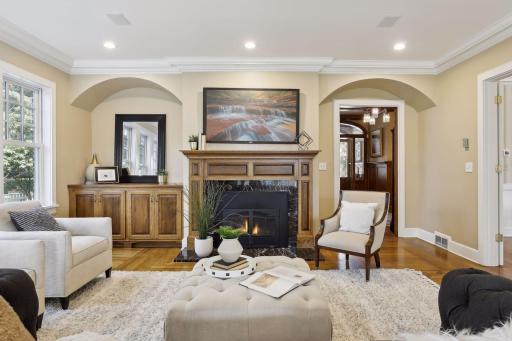 The mood-setting gas fireplace will be the focal point of the room. Relax here to discuss the events of the day with family and friends. There is a recessed niche and an entryway with arched accents for visual interest.