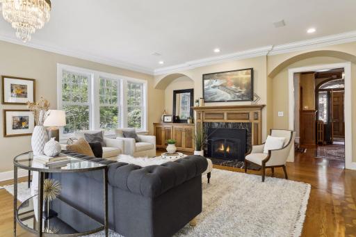 Discover lovely hardwood floors with inlaid accents, coved ceilings with recessed lighting and a beautiful chandelier.