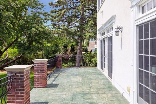 The terrace can be accessed from either the living room or the sunroom.