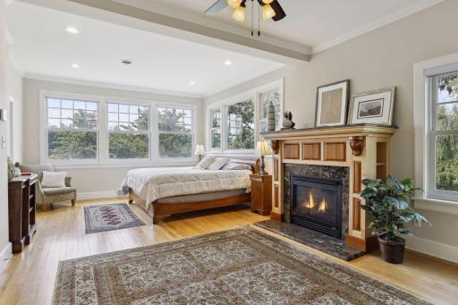 Escape to the luxurious ownerâs suite, accented with walls of windows and hardwood floors. A gas fireplace adds comfort and warmth on chilly winter nights.