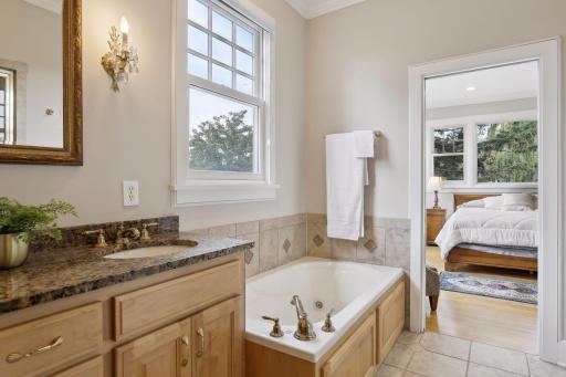 There is also a separate jetted tub and a vanity with dual sinks.