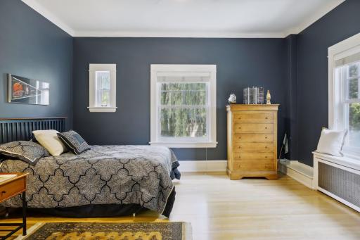 The second and third bedrooms each have hardwood floors and ceiling fans.