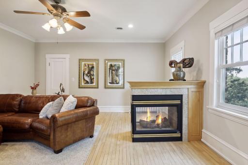 Enjoy the warmth of the three-sided gas fireplace!