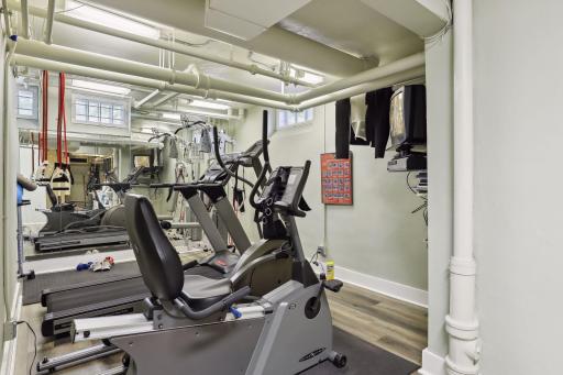 Keep fit and active in the exercise room, featuring a mirrored wall and EZ care flooring.