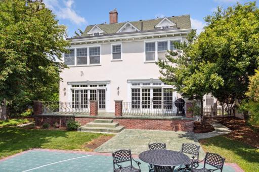 Enjoy outdoor gatherings in pleasant weather on the stamped concrete terrace overlooking the private backyard.