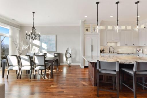 Grab a bite at the large center island or enjoy a meal at the dining table