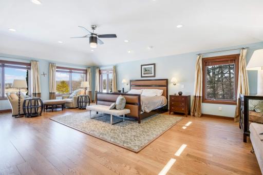 Primary bedroom with sitting area - great place to relax with incredible views of Spring lake and pond