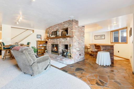 Family Room with Wood Fireplace and wet bar area