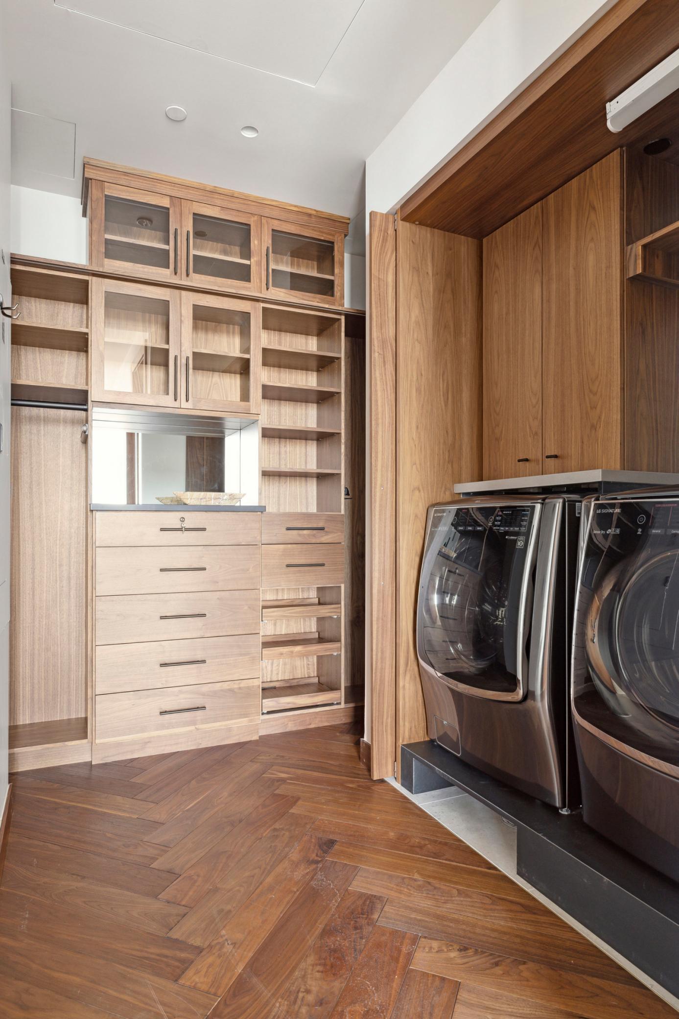 Large owners walk-in closet includes laundry.