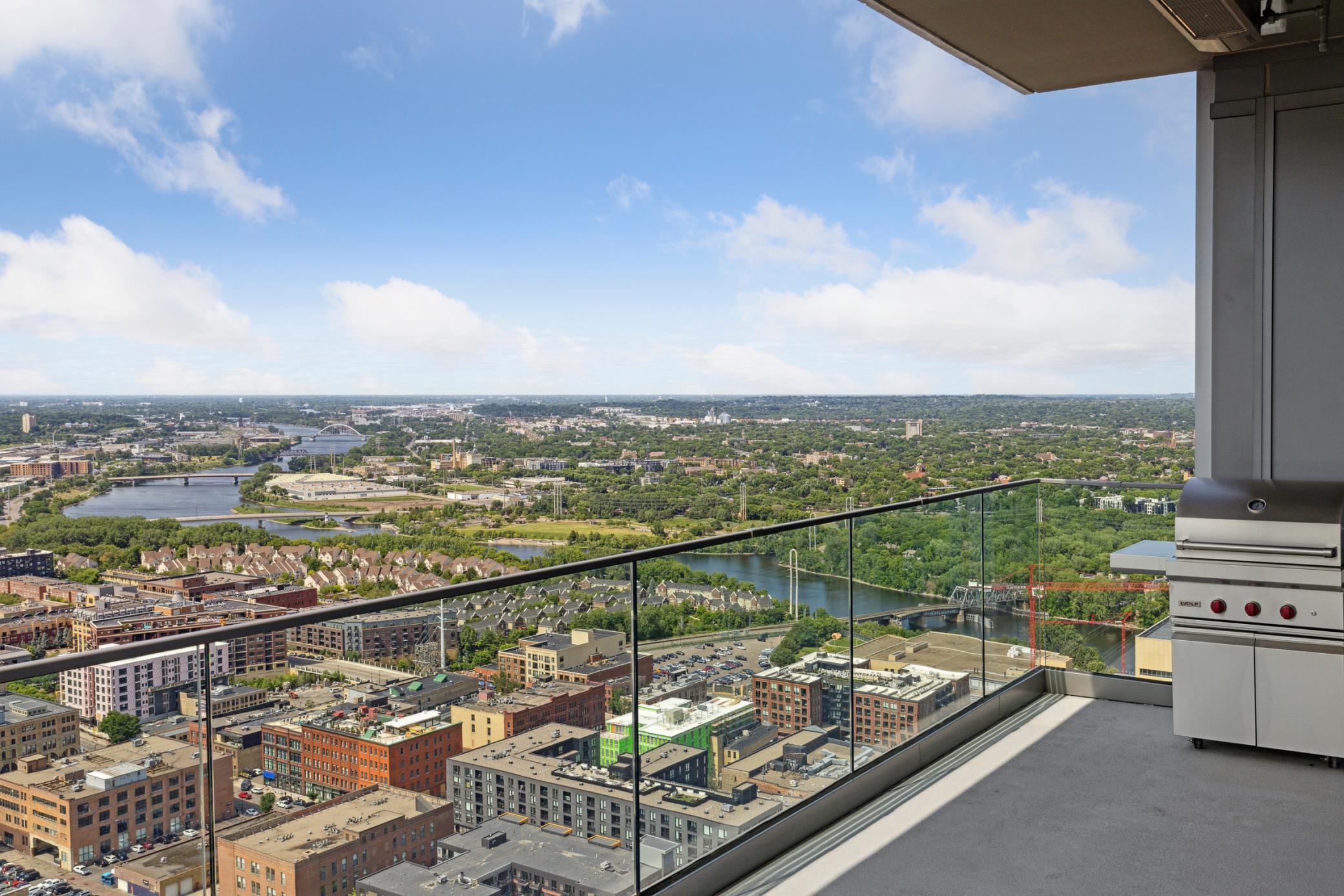 Large covered terrace comes with overhead heater and Wolf gas grill.