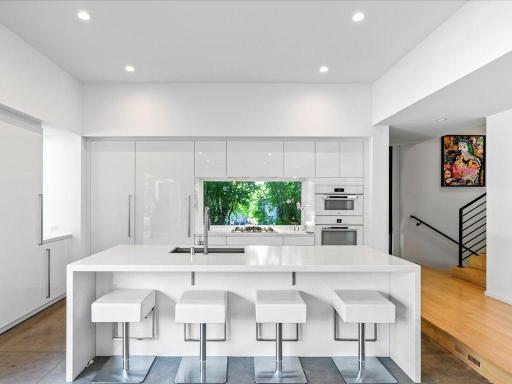 High-end Miele appliances, Leicht custom cabinets, Paramount engineered quartz
