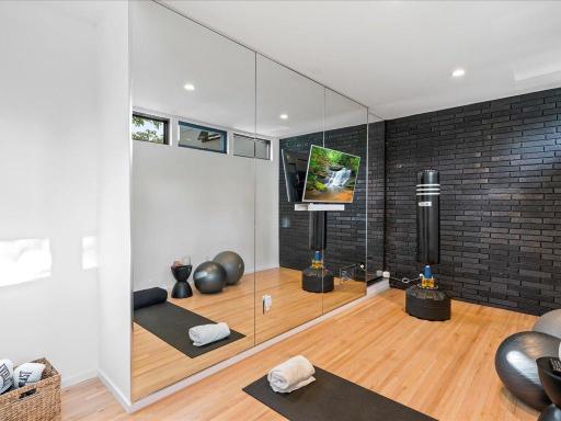 As you enter the home, see if you can find the concealed doors with soss hinges that open to the excercise room.