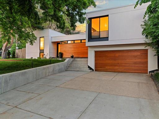 Therma-Tru Custom front door and custom garage doors with electric car charging port inside.