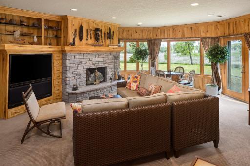 Lower Level Family Room with warm paneled walls and views