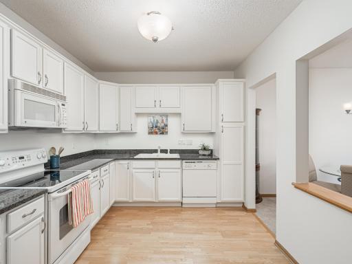 Corner cabinet has Lazy Susan with pull-outs in some cabinets.