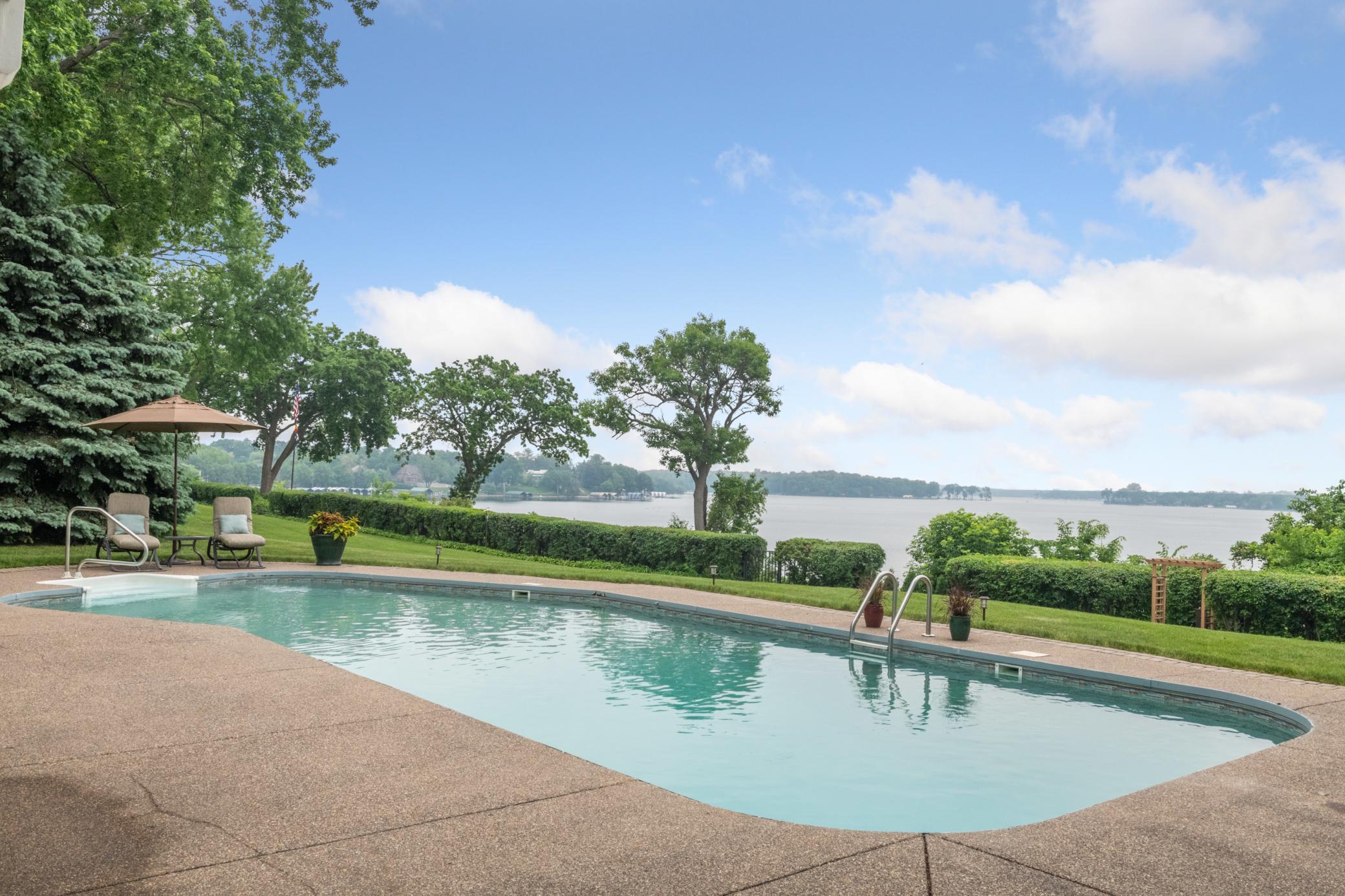 Summertime is complete with the refreshing pool surrounded by multiple seating areas