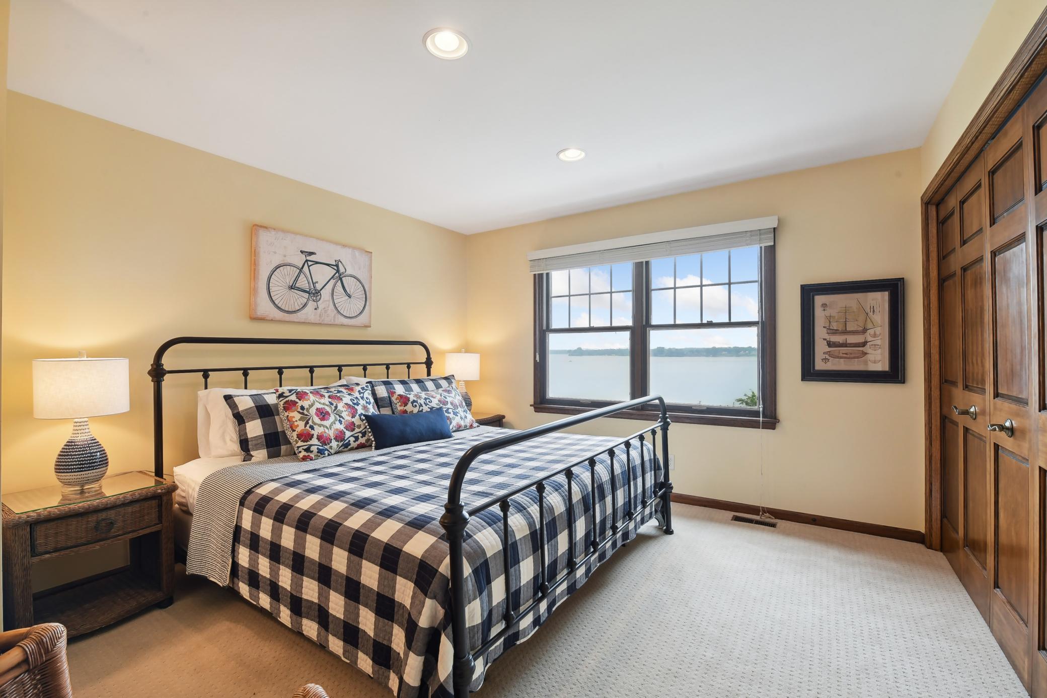 Bedroom 3 features a large wall closet and long lake views.