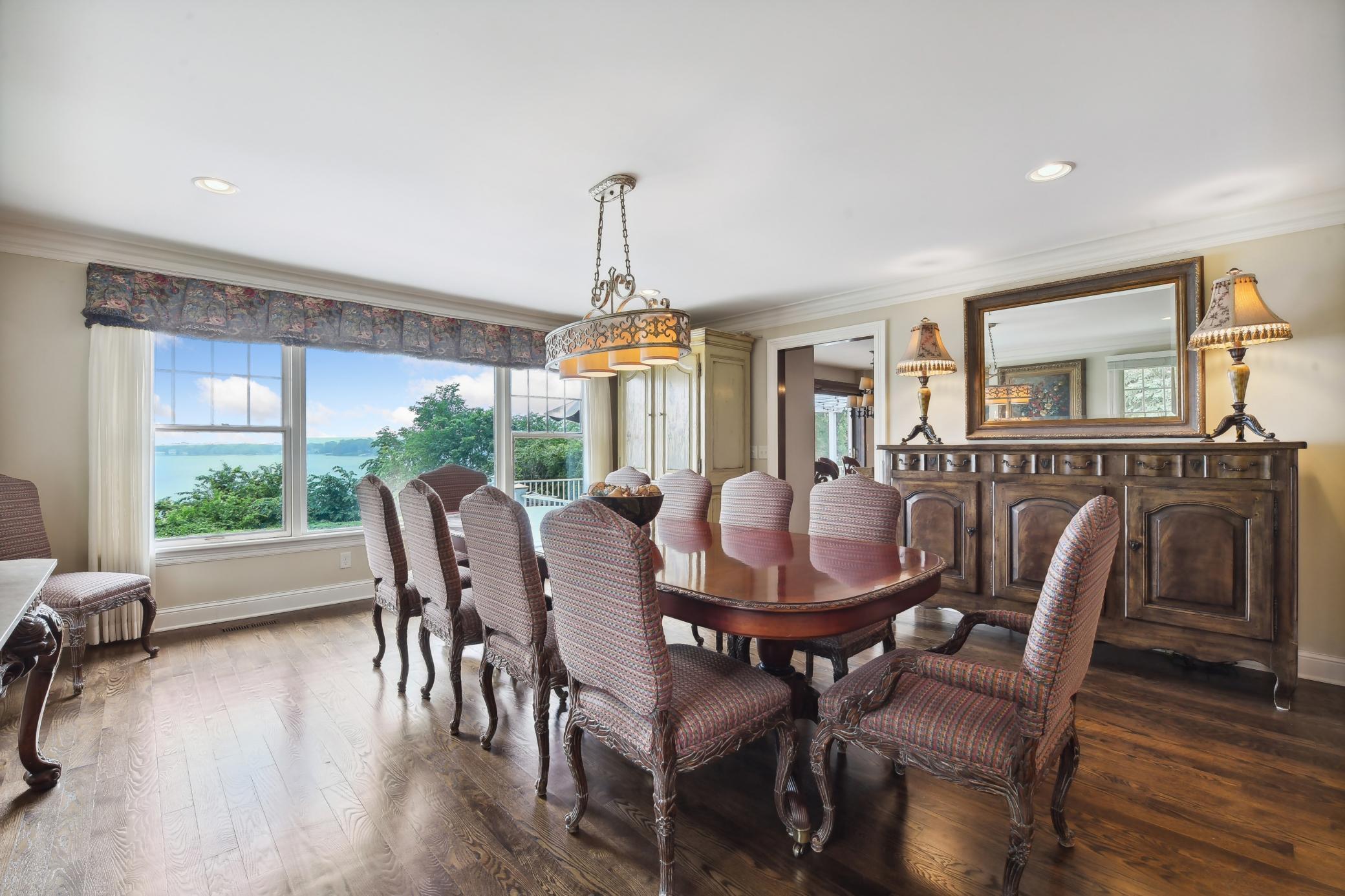 You'll love to host gatherings in the generous-sized dining room featuring a wall of windows with lake views.