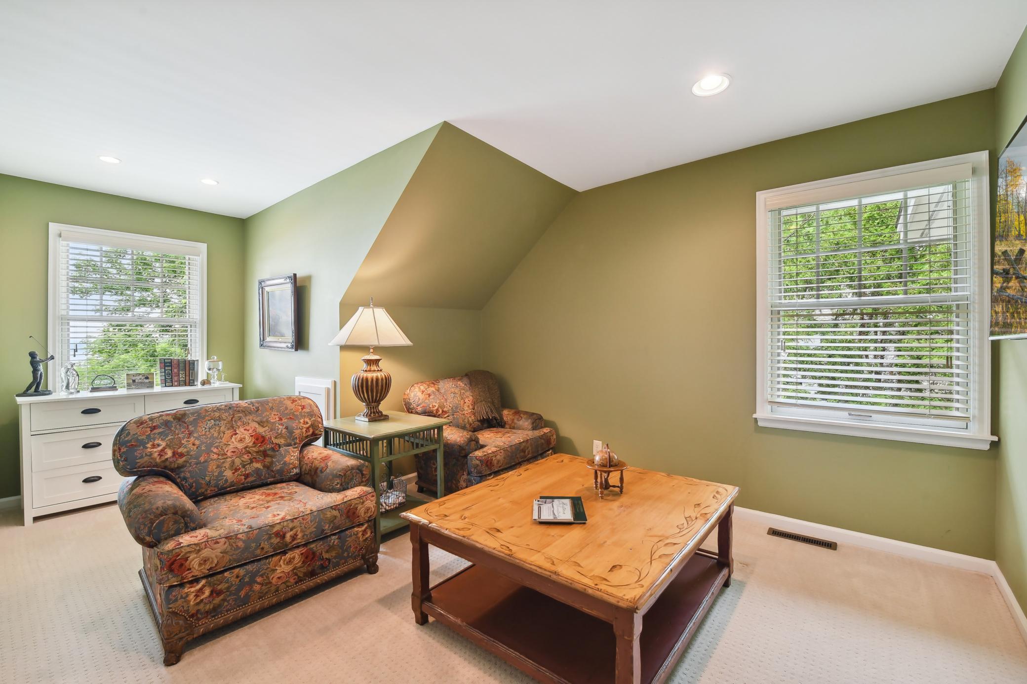 Bedroom 4 is currently used as a den. It offers a large wall closet with custom organizers and lake views.