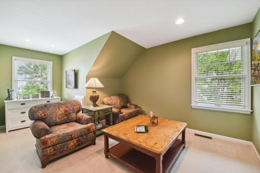 Bedroom 4 is currently used as a den. It offers a large wall closet with custom organizers and lake views.