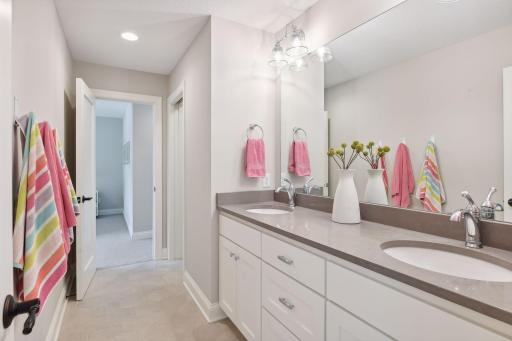 Jack and Jill 3/4 bathroom connects two of the guest bedrooms upstairs.