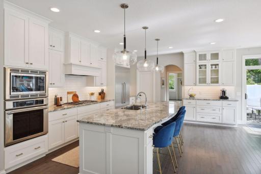Fabulous cook's kitchen with Thermador appliances, built-in wall oven/microwave, beverage bar and pantry.