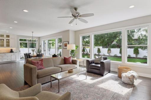 Beautiful landscaping and large picture windows bring the outside in.
