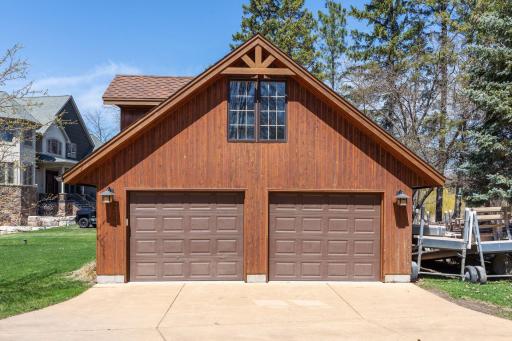 An additional two car garage with an unfinished upper room offers another opportunity for more guest space.