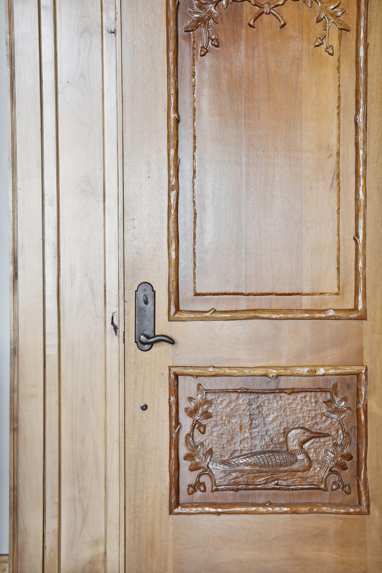 Custom hand carved doors throughout