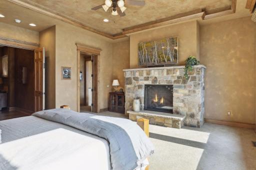 A custom stone fireplace centers this gorgeous suite.