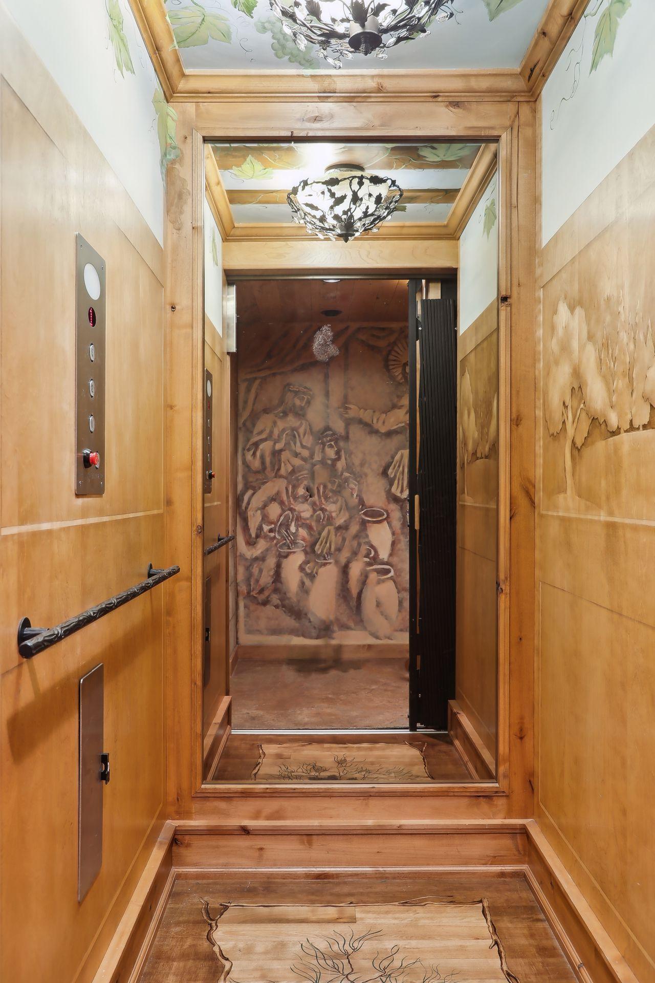 Elevator to all levels with hand painted details