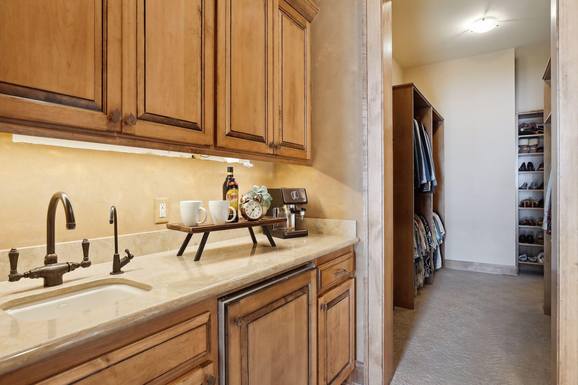A private Espresso Bar and refrigerator as part of the main suite design