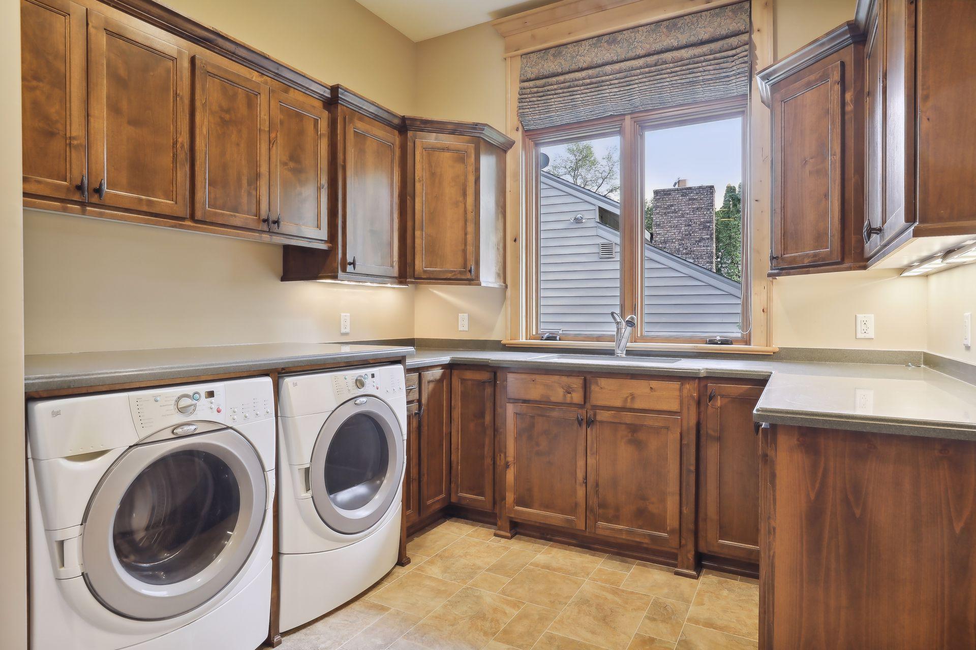 Main floor laundry with secret tunnel to the primary suite's closet