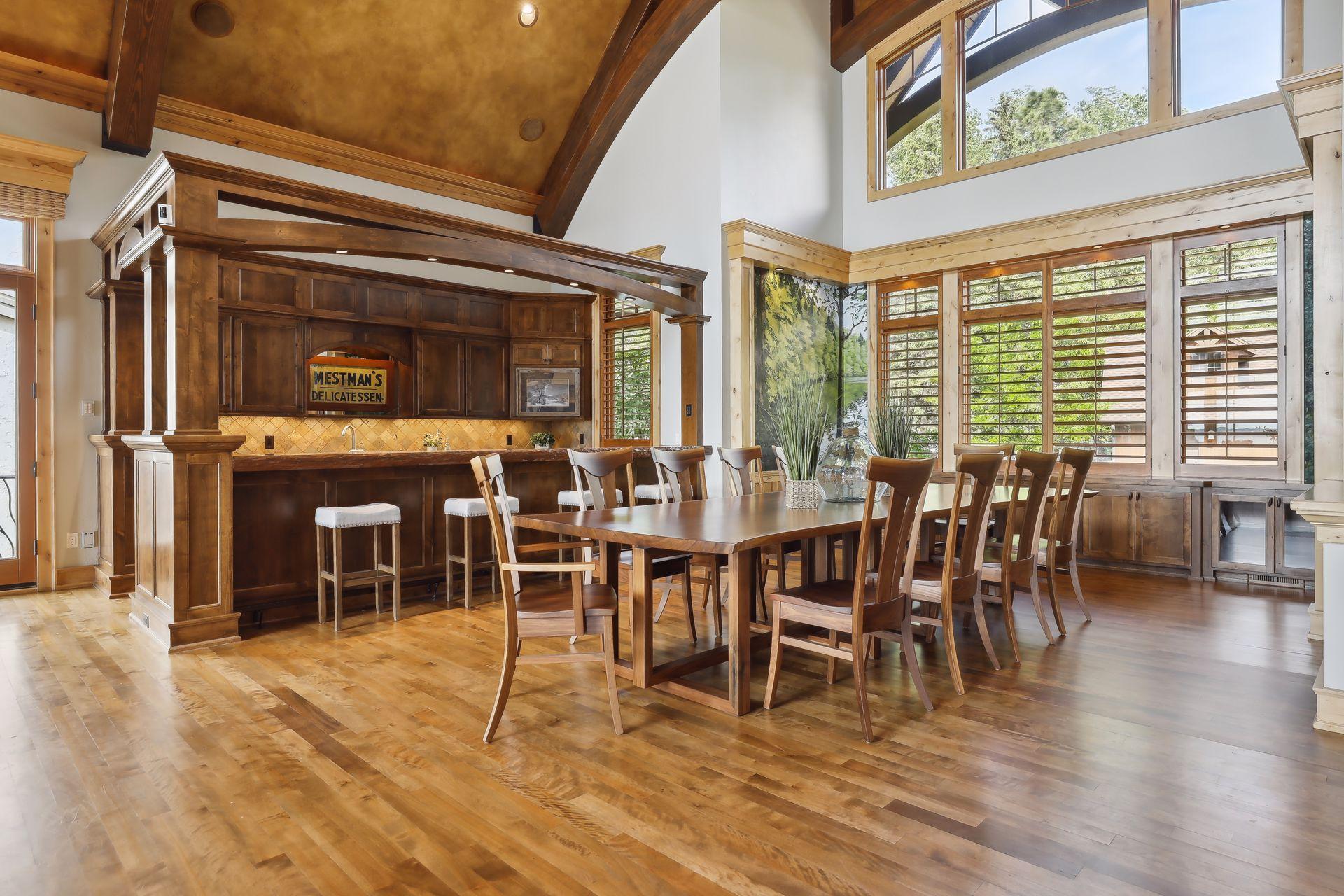 The design of the dining space is center stage with gorgeous windows from front to back
