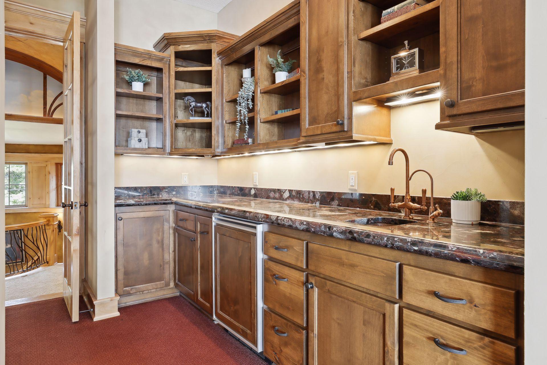 Mini kitchen in the home office with a sink and refrigerator