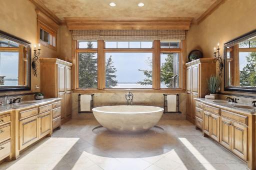 This custom designed stone soaking tub offers a supreme 5 star experience and the view is STUNNING.
