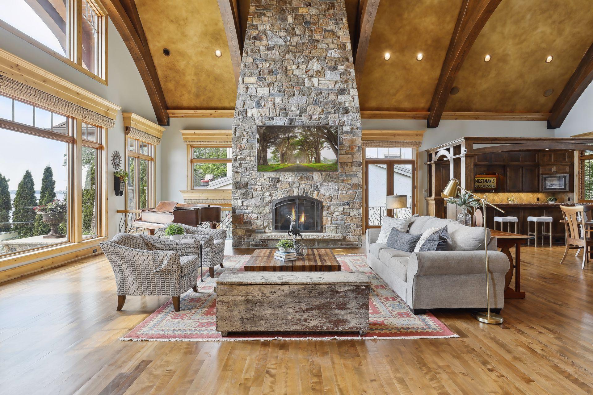 Floor to ceiling stone fireplace centers the Great Room