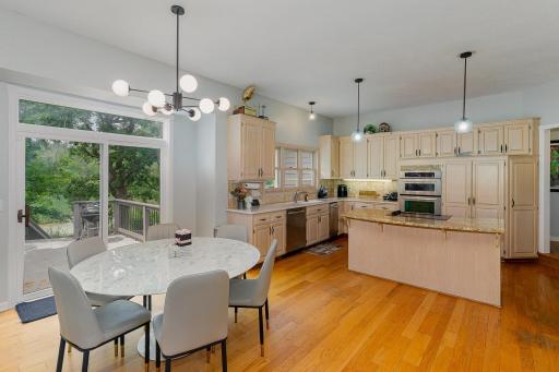 Dining room with view of kitchen in the background