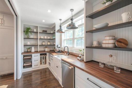 Just off the kitchen you'll find storage galore in the butlers pantry.
