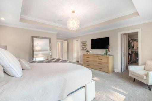 One of two walk-in closets is accessed from the bedroom.