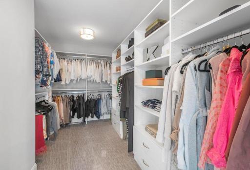 One of 2 walk-in closets in primary suite.