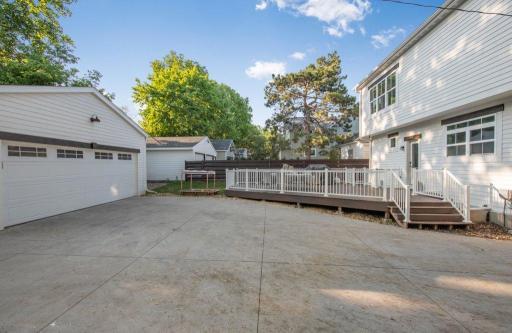 Concrete driveway with room to park a few additional cars if needed.