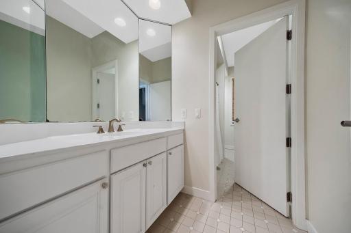 Full bathroom with a separate tub/shower, toilet room.