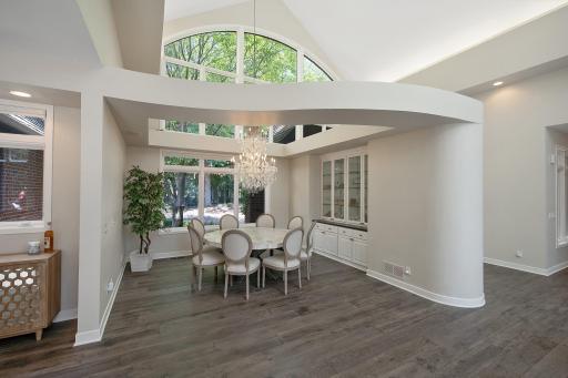 Formal dining room has a dramatic chandelier and built in china cabinet.