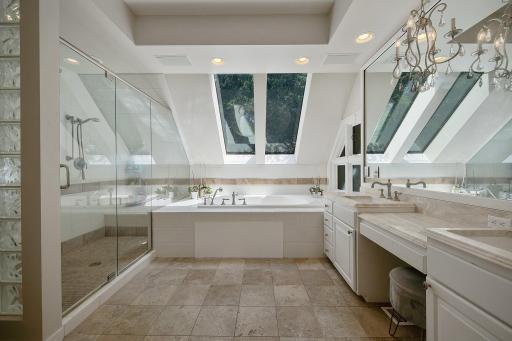 Owner's bath includes walk in shower with dual shower heads, dual sinks and a whirlpool tub.