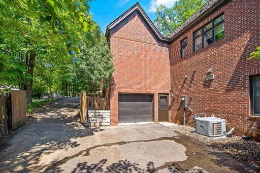 Lower level garage door to the workshop. Full driveway for cars and boats. Great place for outside storage. Fully fenced!